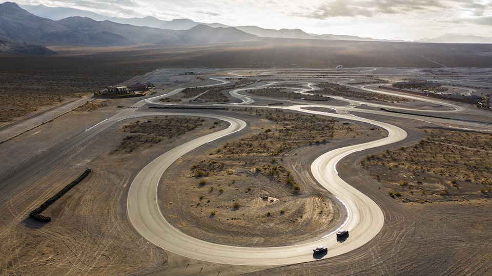 An aerial shot of the curvaceous racetrack at Spring Mountain Country Club in the Nevada Desert.