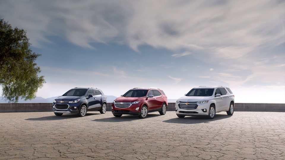 Chevrolet Trax, Equinox and Traverse crossovers parked next to each other.