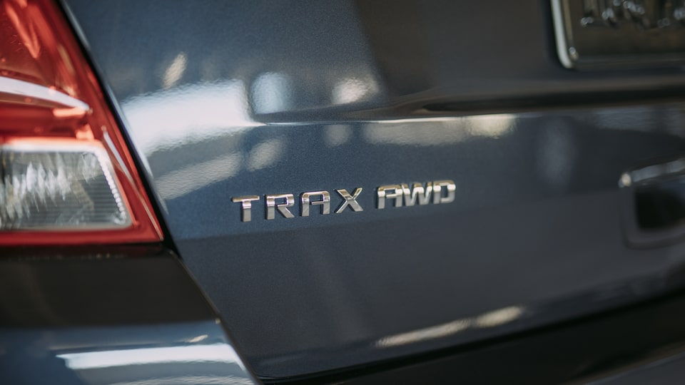 Close-up photo of Trax All-Wheel Drive emblem.