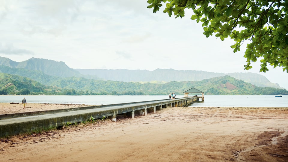 The end of Weke Road in Hanalei, Hawaii, is a popular spot to watch the sun set over Hanalei Bay.