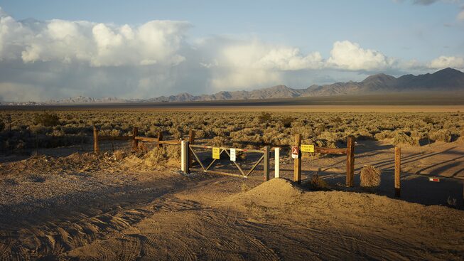 Aside from a fence, the line between Yates Well Road in Nipton, California, and the desert is indistinguishable.