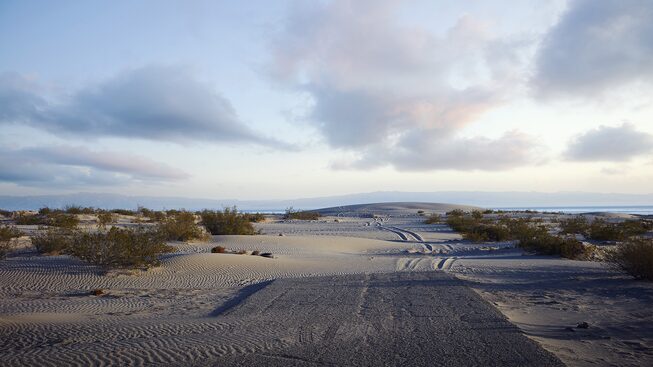 A sand-covered road leading into Salton Sea, California.