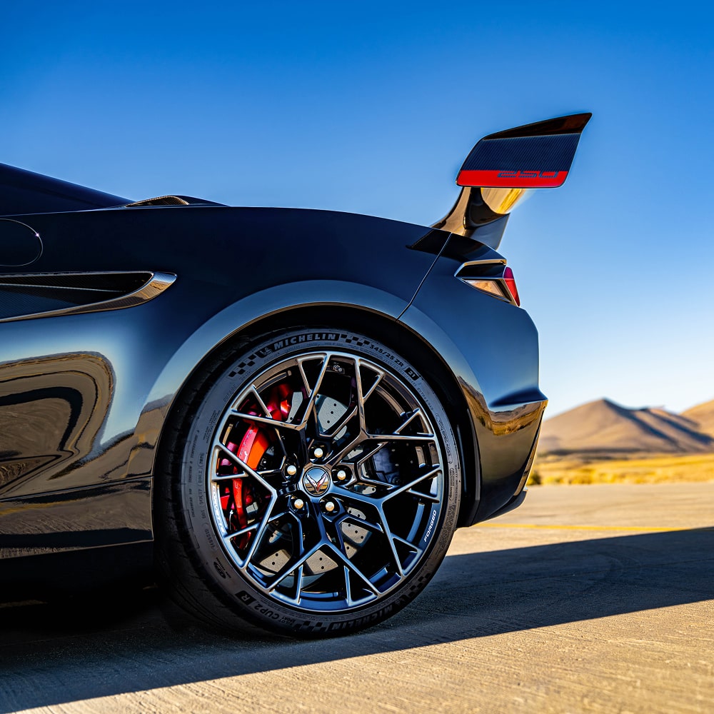 Close-up View of the Rear Tire on a Black Chevy Corvette.