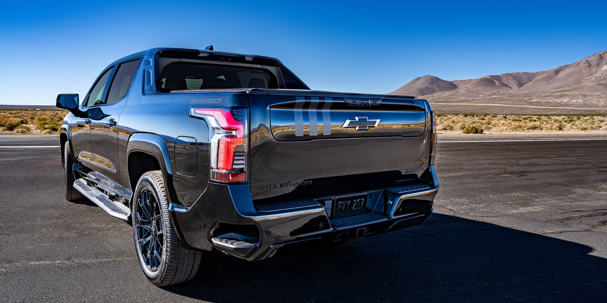 A Rear Three-Quarter View of the Black Chevrolet Silverado EV, Showcasing its Modern Tailgate Design.
