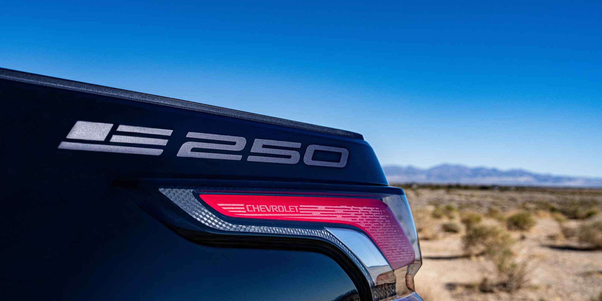 A Detailed Shot of the Chevrolet Silverado EV Stars and Steel Edition, Highlighting the 250 Anniversary Badge.