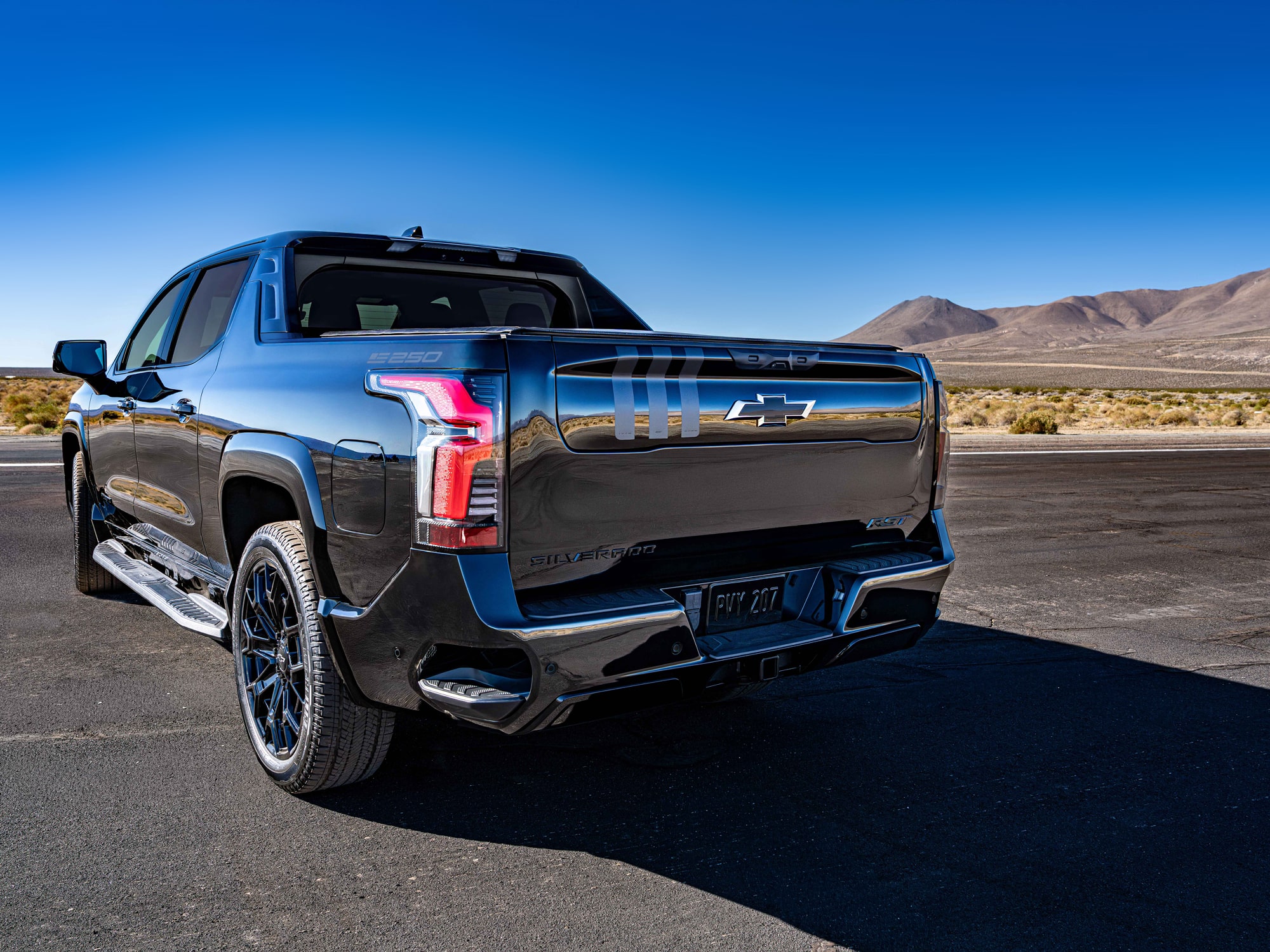 A Rear Three-Quarter View of the Black Chevrolet Silverado EV, Showcasing its Modern Tailgate Design.
