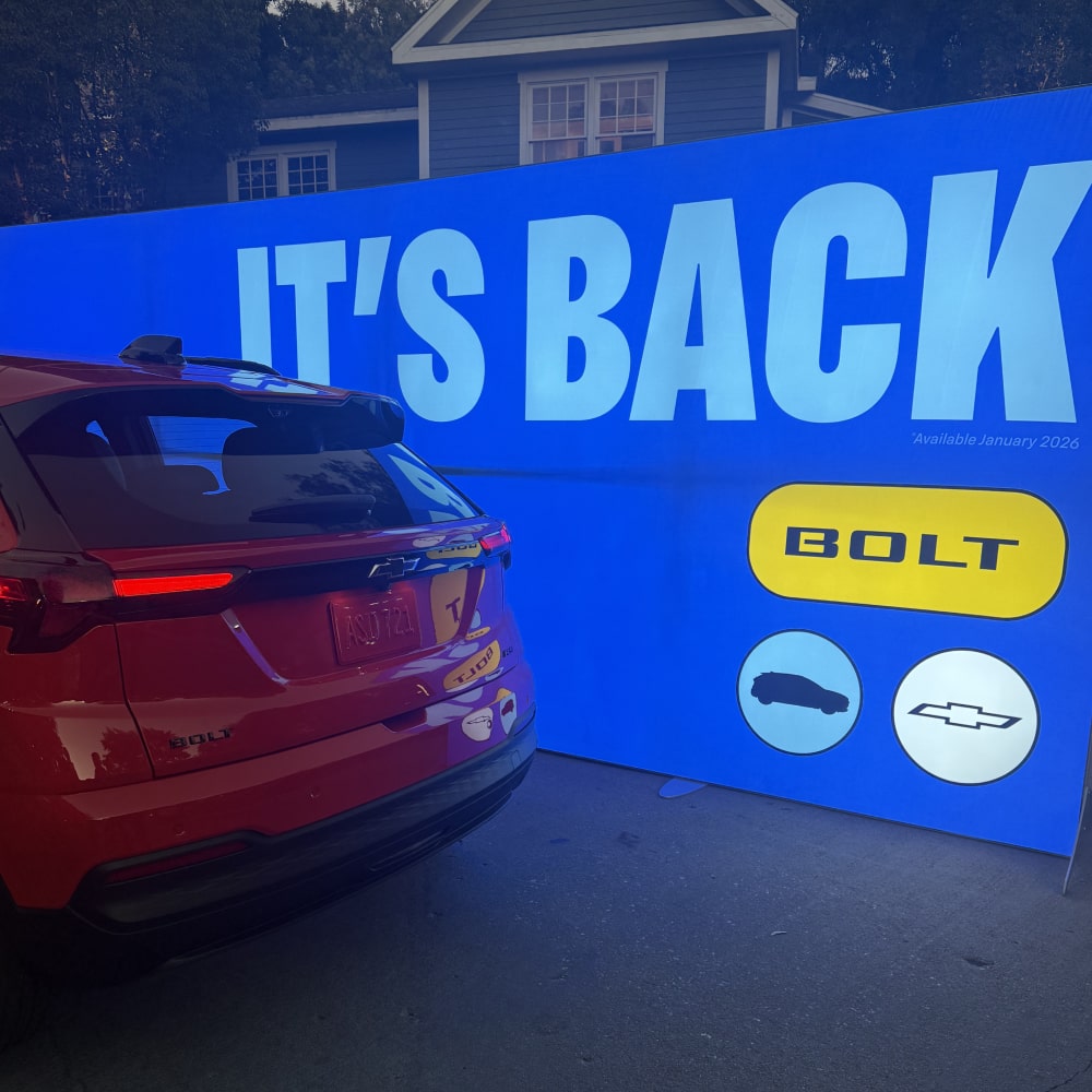 A 2027 Chevrolet Bolt in Habanero Orange Parked