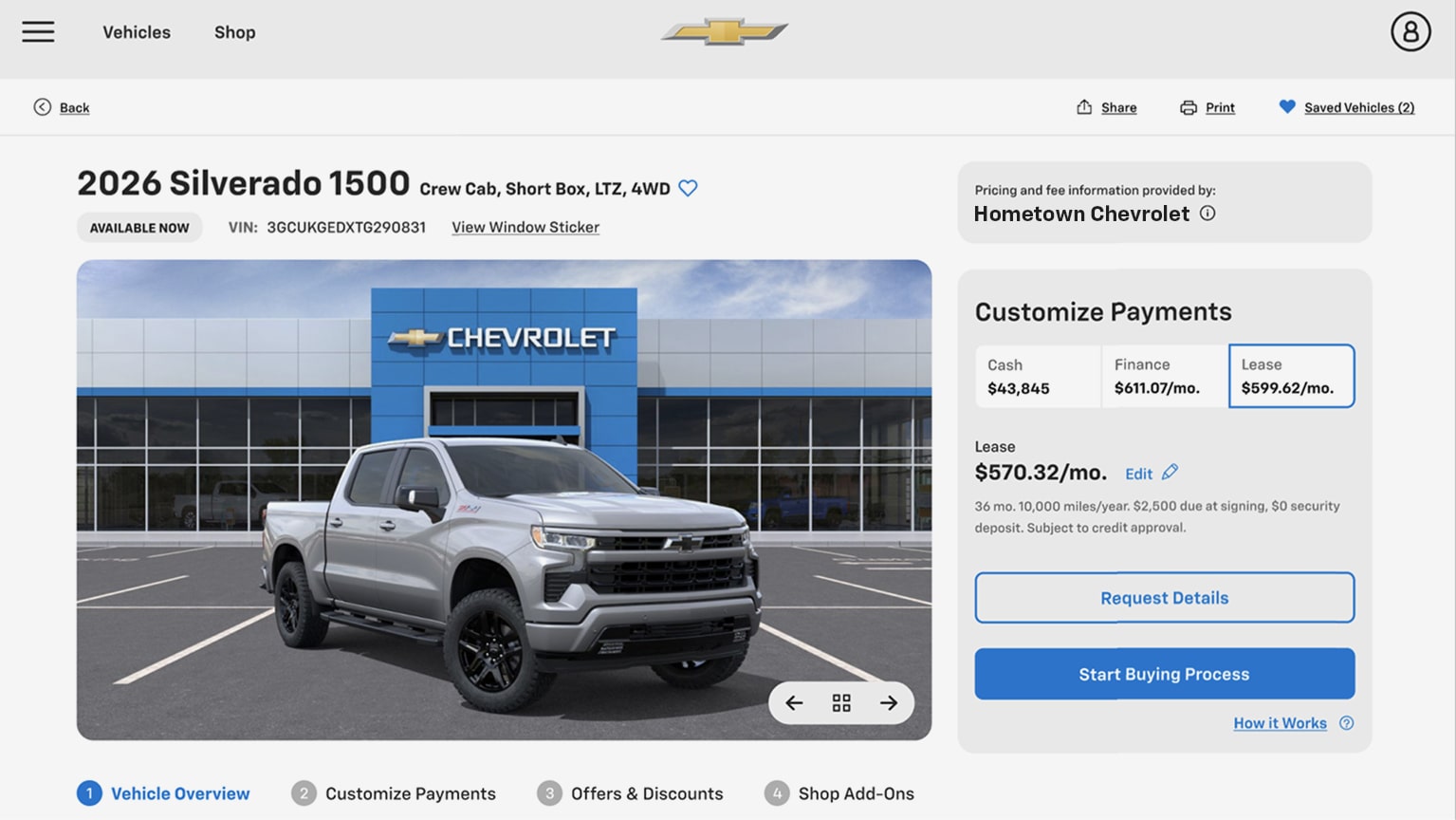 A Chevrolet Silverado 1500 Vehicle Details Page Showing Online Payment Options, Vehicle Pricing, and a Pickup Truck Parked in Front of a Chevrolet Dealership.