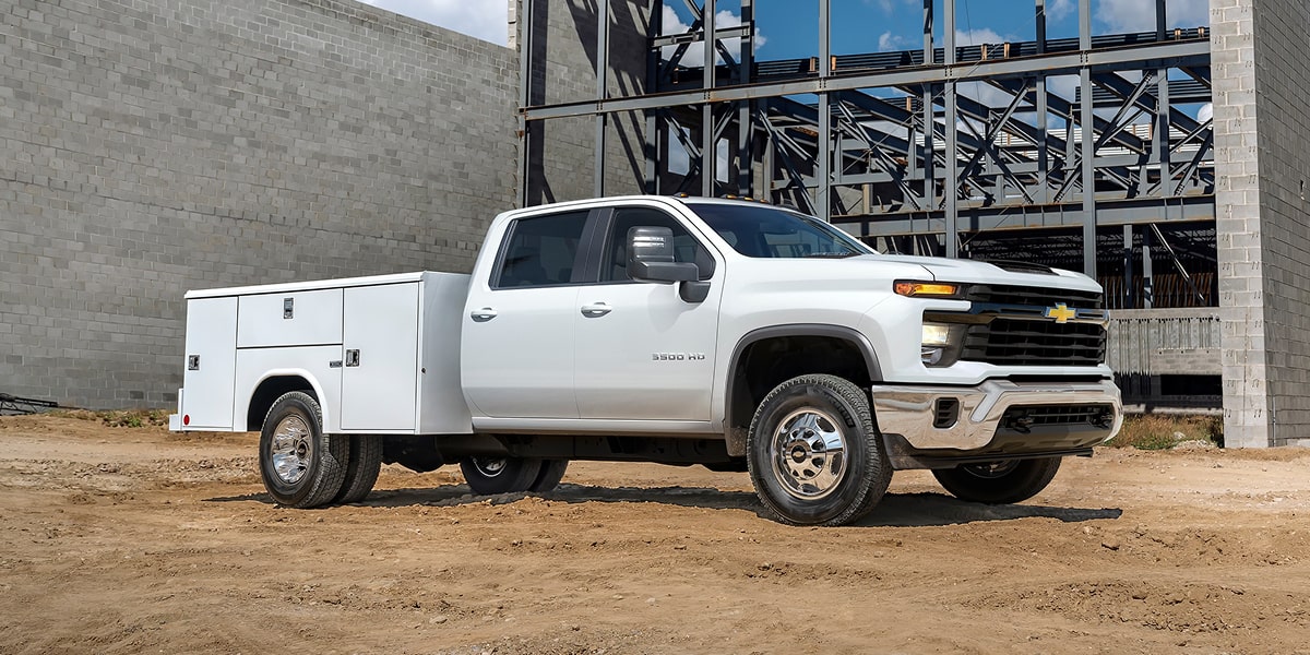 2026 Chevy Silverado 3500 HD Chassis Cab With a Utility Bed Parked at a Construction Site