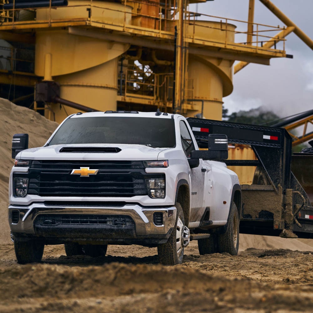 The 2026 Chevy Silverado HD Towing a Bulldozer on a Construction Site