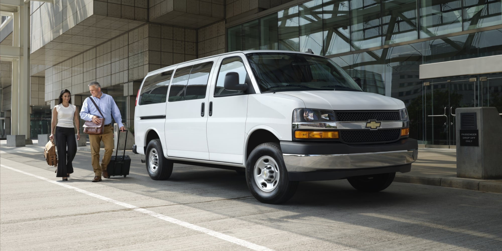2026 Chevy Express Passenger Van Dropping Off a Family at a Hotel