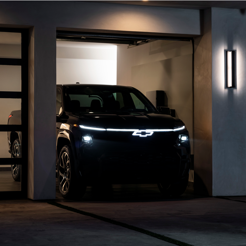 Chevy Silverado EV Charging in a Garage at Night