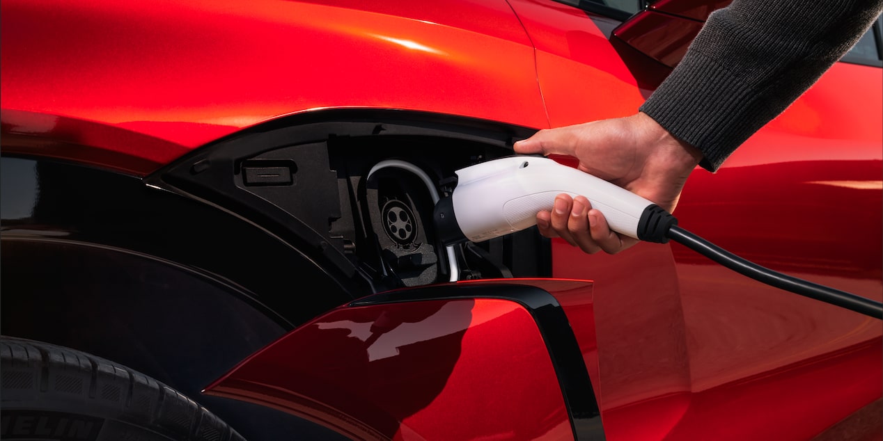 A Person Plugging Their 2026 Chevy Blazer EV to Charge