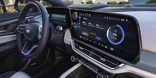 The Driver's Perspective Inside a Chevrolet Equinox EV, Highlighting the Digital Instrument Cluster and Infotainment Screen.