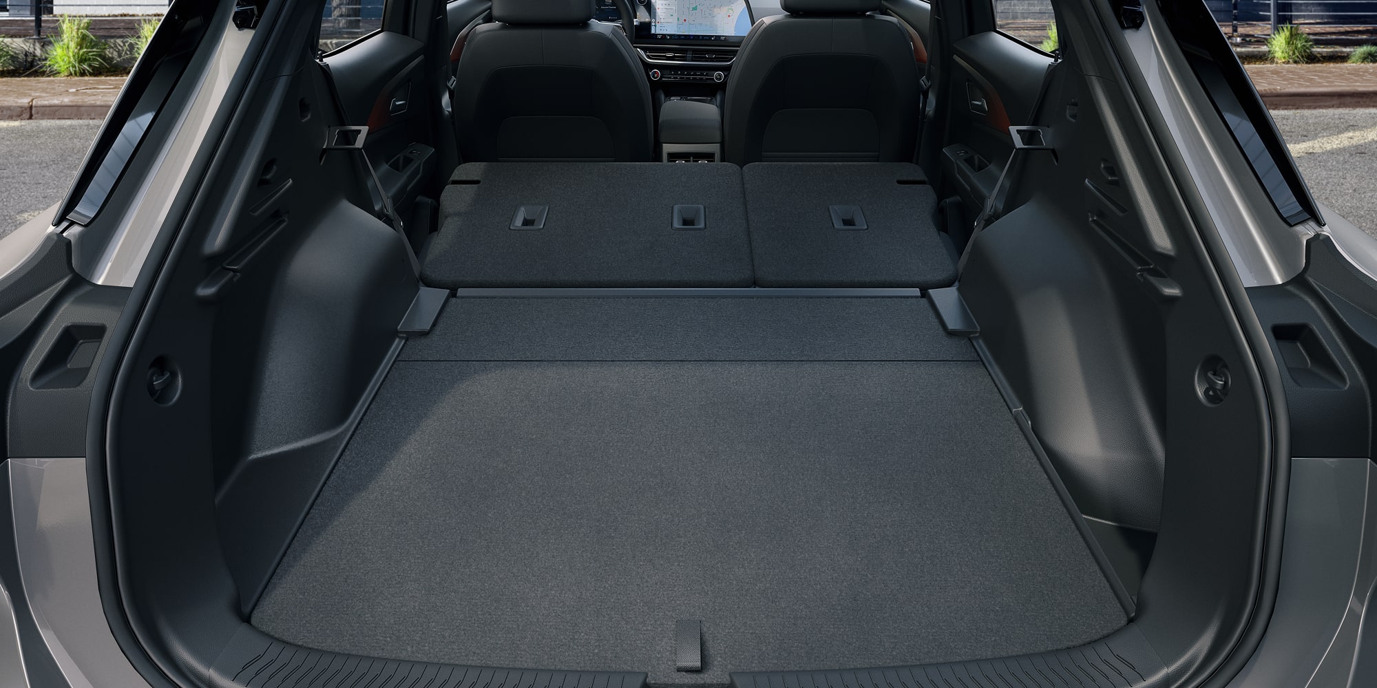 The Spacious Rear Cargo Area of a Chevrolet Equinox EV With the Seats Folded Down for Maximum Storage.