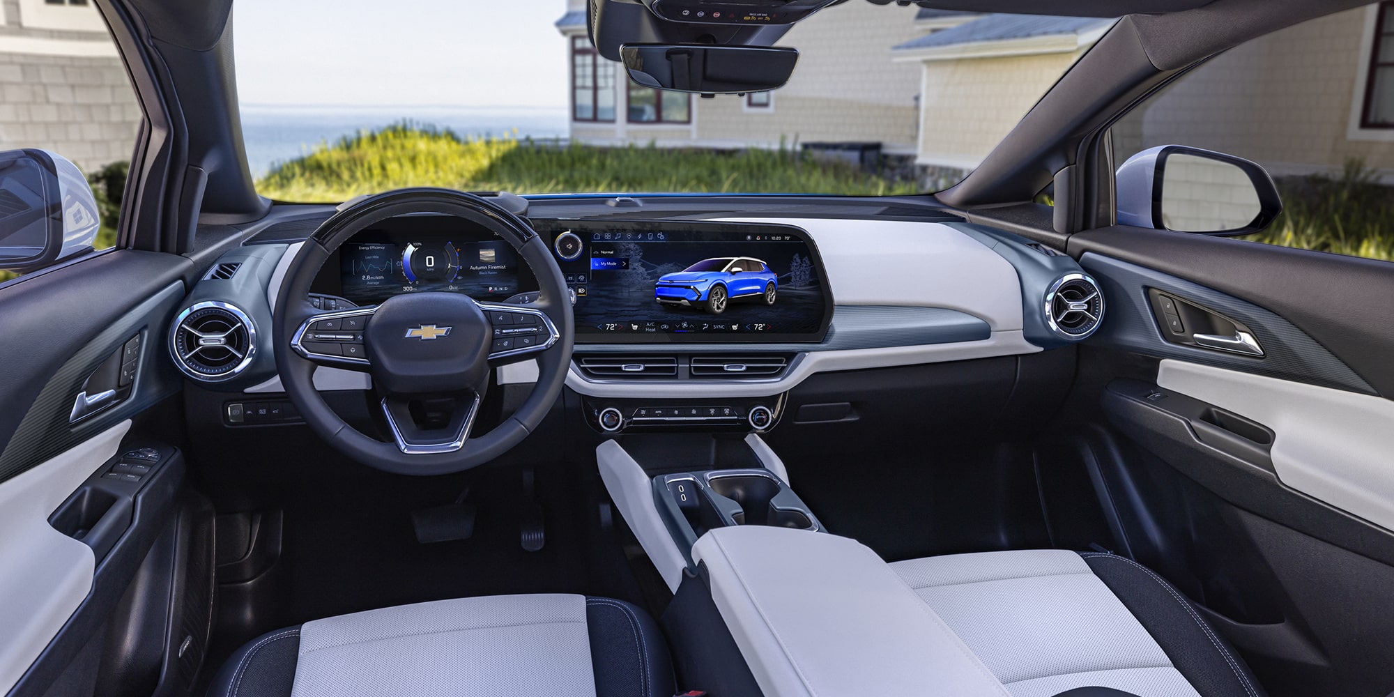 The Detailed Interior Cockpit of a Chevrolet Equinox EV, Showing the Steering Wheel and Dual Digital Displays.