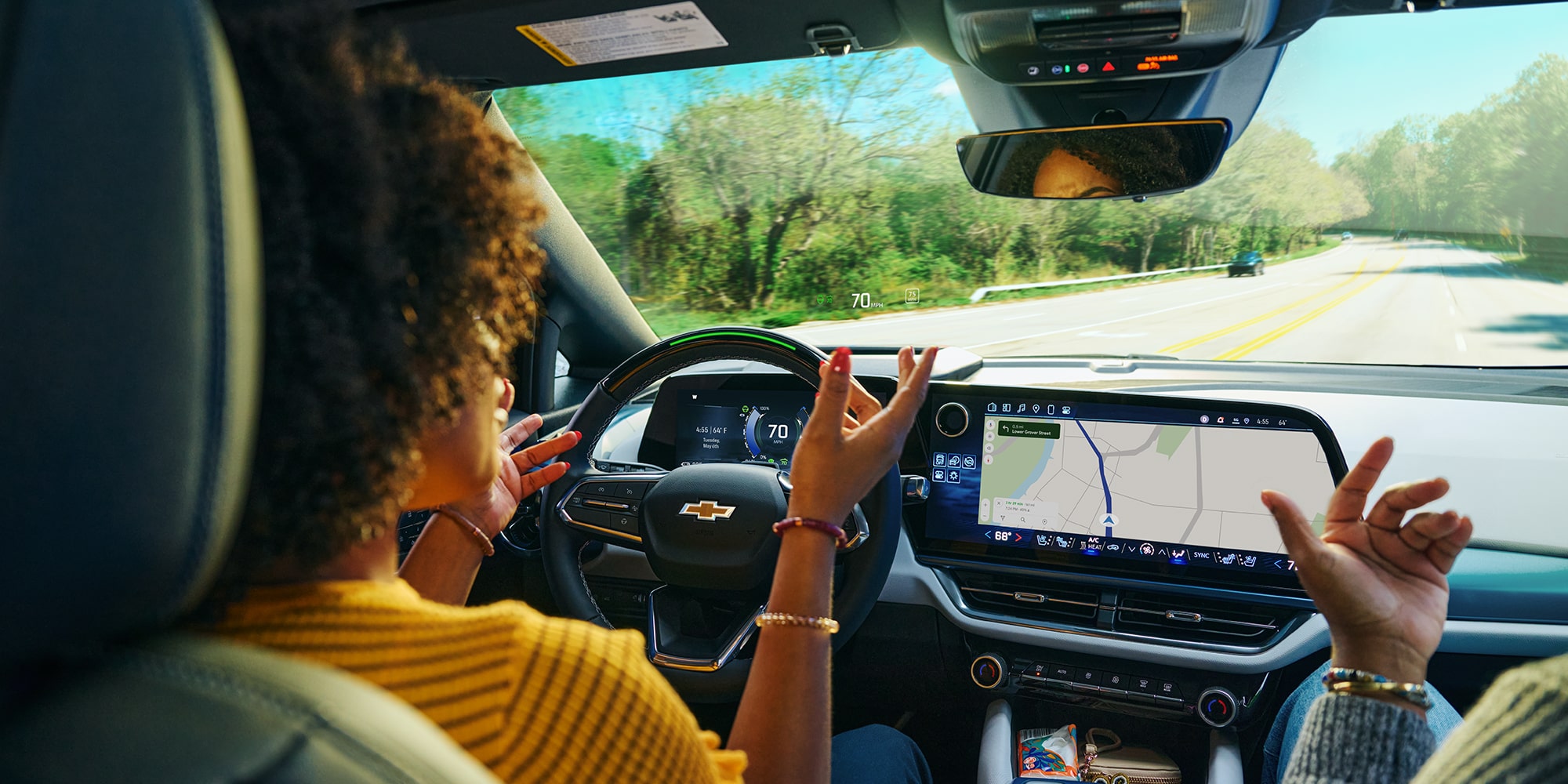 Two People Driving in an Equinox EV