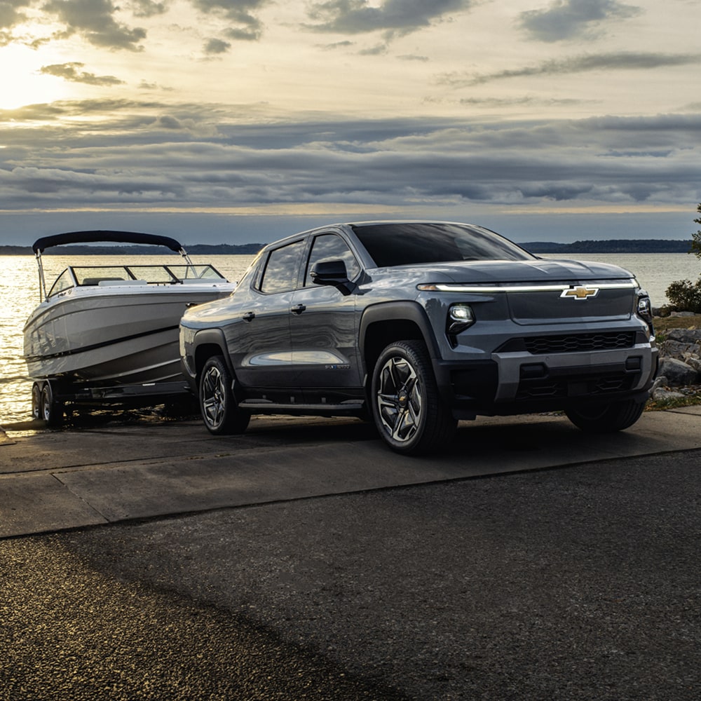 2026 Chevy Silverado EV Launching a Boat on a Lake