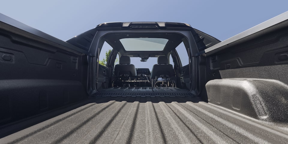 Ground Level View of the Cargo Bed of a 2026 Black Chevy Silverado EV