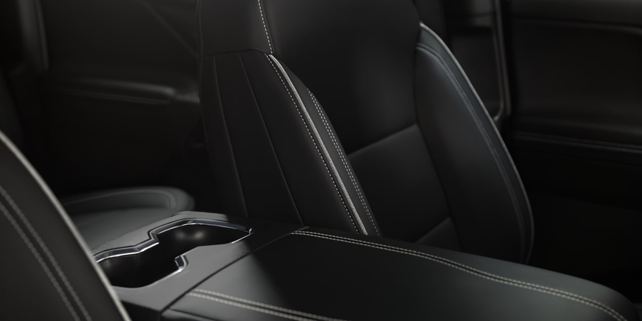Close-up of the Interior Seats and Cup Holder of a 2026 Chevy Silverado EV