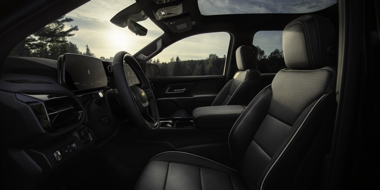 Side View of the Drivers Seat with Steering Wheel of a 2026 Chevy Silverado EV before Sunset