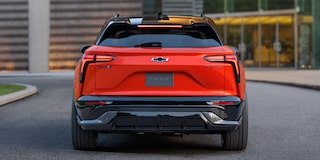 The Rear View of a 2027 Chevy Blazer EV SS Featuring LED Taillights, an Integrated Roof Spoiler, Sculpted Body Panels, and the Chevy Bowtie Emblem Centered on the Liftgate.