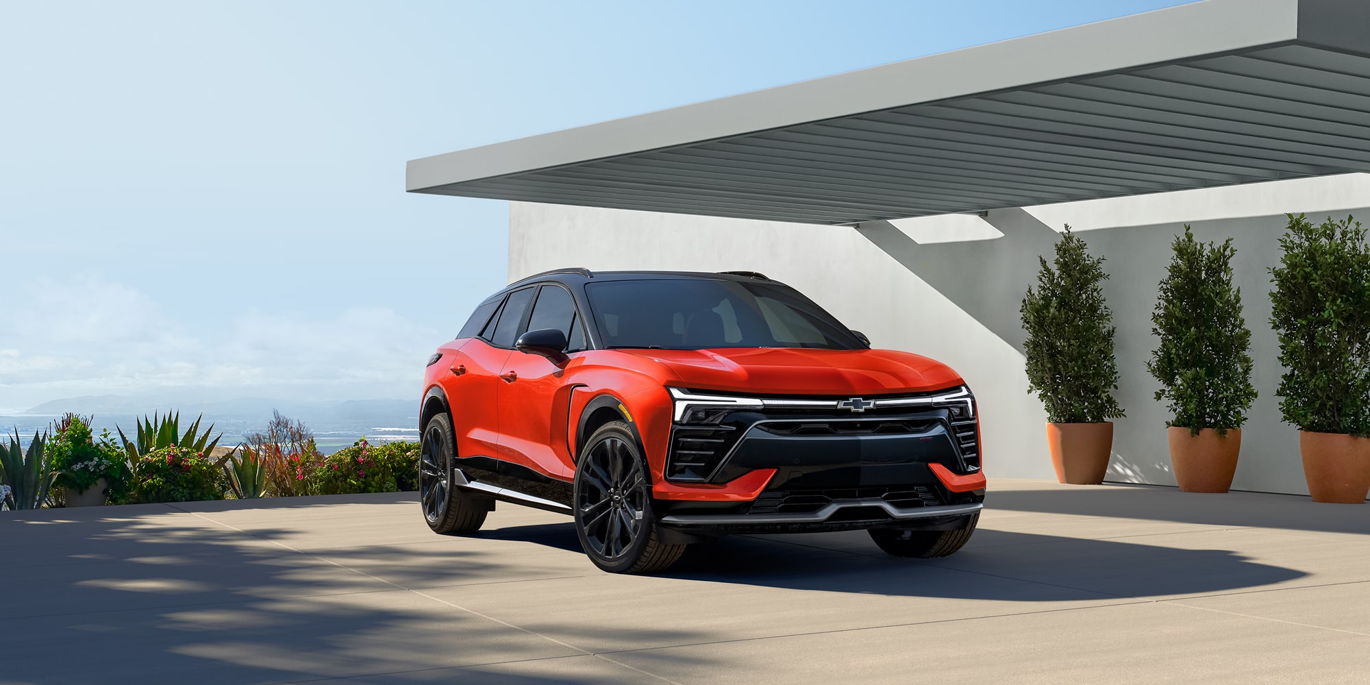 Side Profile View of the 2027 Chevy Blazer EV SS Parked Under an Awning.