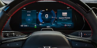 The Digital Driver Information Center of a 2027 Chevy Blazer EV SS Displaying Vehicle Data, Battery Information, Navigation Features, and Driving Metrics Behind the Steering Wheel.