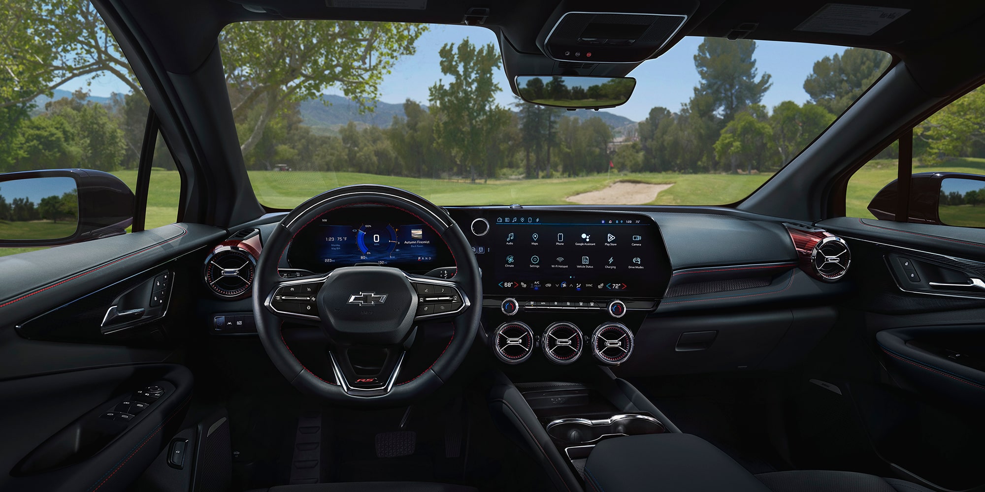 The Driver-Focused Interior of a 2027 Chevy Blazer EV SS Featuring a Multifunction Steering Wheel, Digital Instrument Cluster, Large Infotainment Touchscreen, and Circular Air Vents Across the Dashboard.