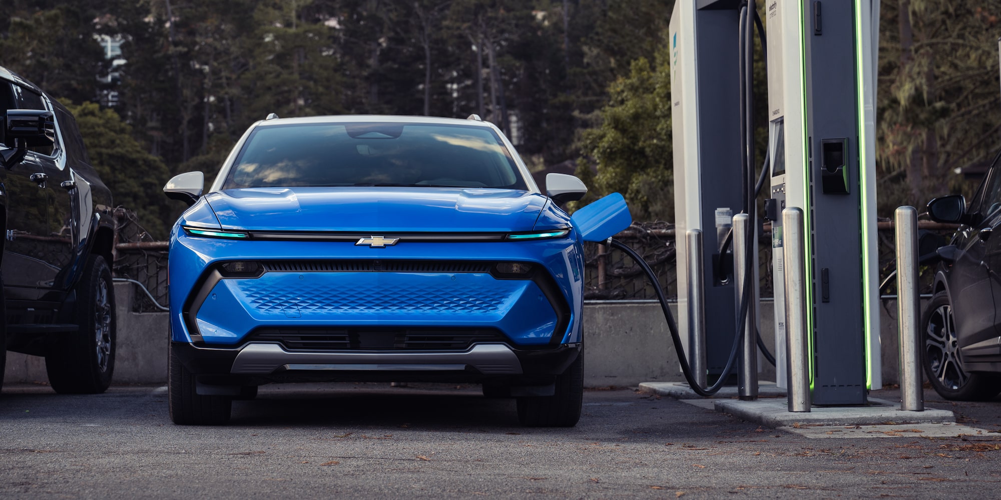 2027 Chevrolet Equinox EV plugged into a DC fast charger, at George Nunnally Chevrolet in Northwest Arkansas