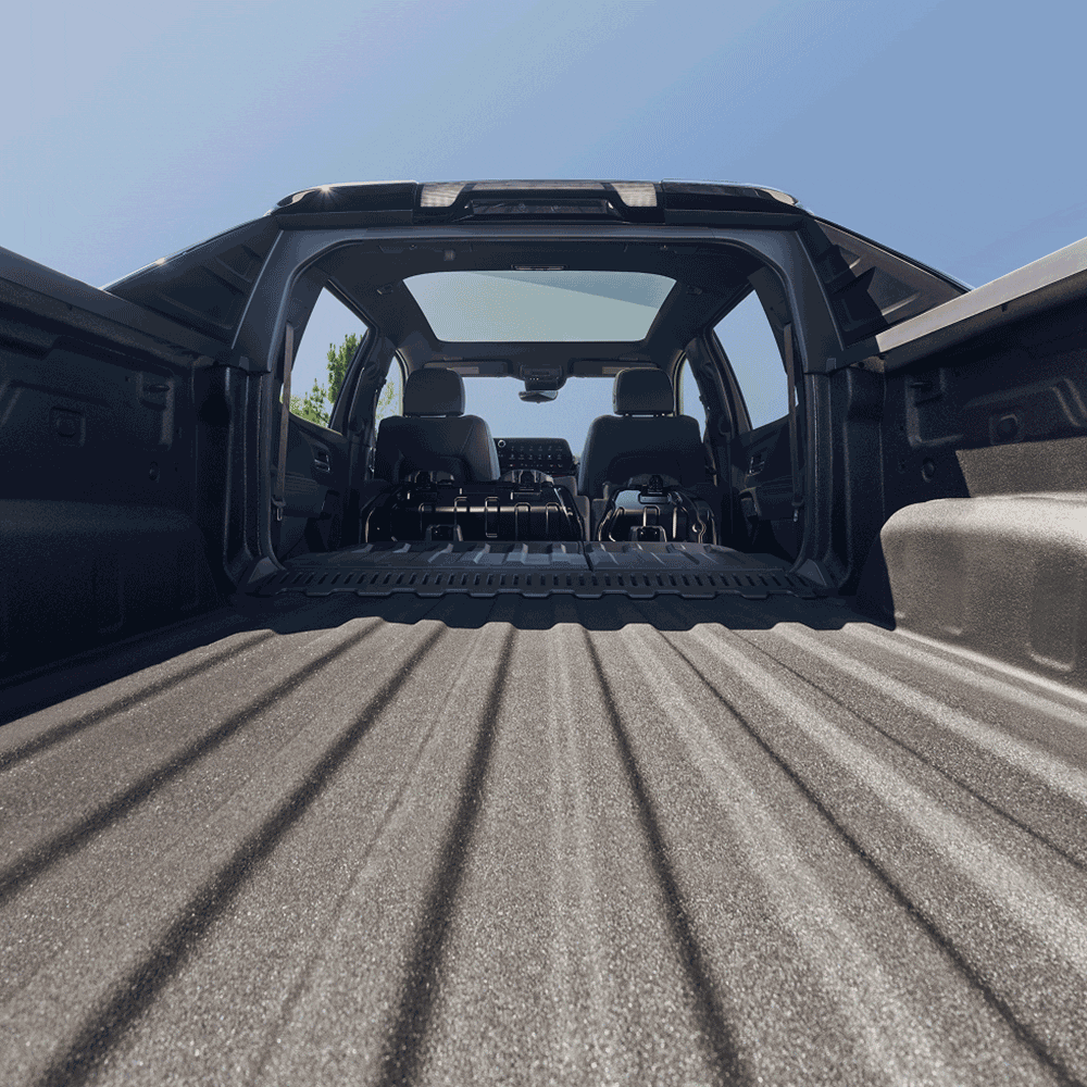 Ground Level View of the Cargo Bed of a 2027 Black Chevy Silverado EV
