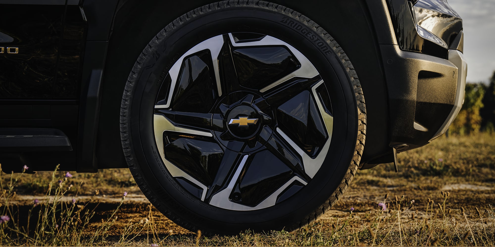 A Close-Up of a Black Alloy Wheel on a Chevy Silverado EV.