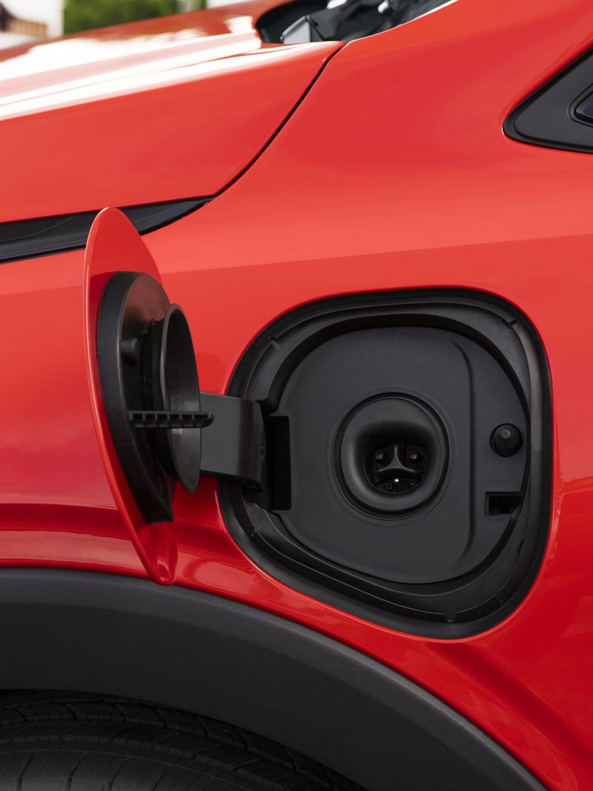 Close-up of the Red 2027 Chevy Bolt Charging Port