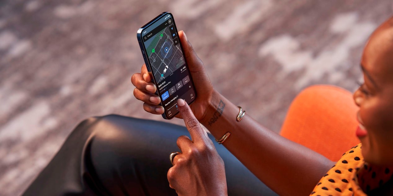 Overhead View of a Woman Using the Chevrolet Mobile App