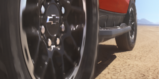 Close-Up of 2026 Chevy Silverado Wheel Showing Tire Design and Suspension System