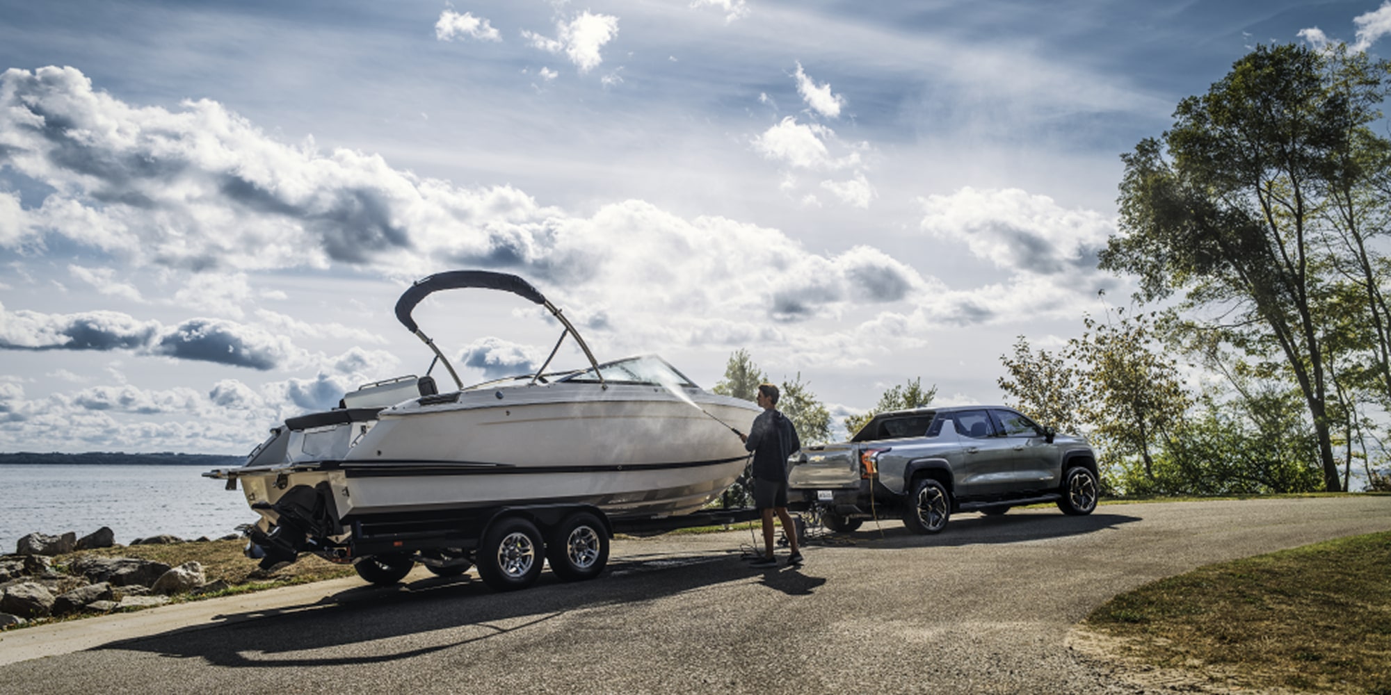 2026 Chevy Silverado Towing a Boat on a Trailer Highlighting its Towing Capability