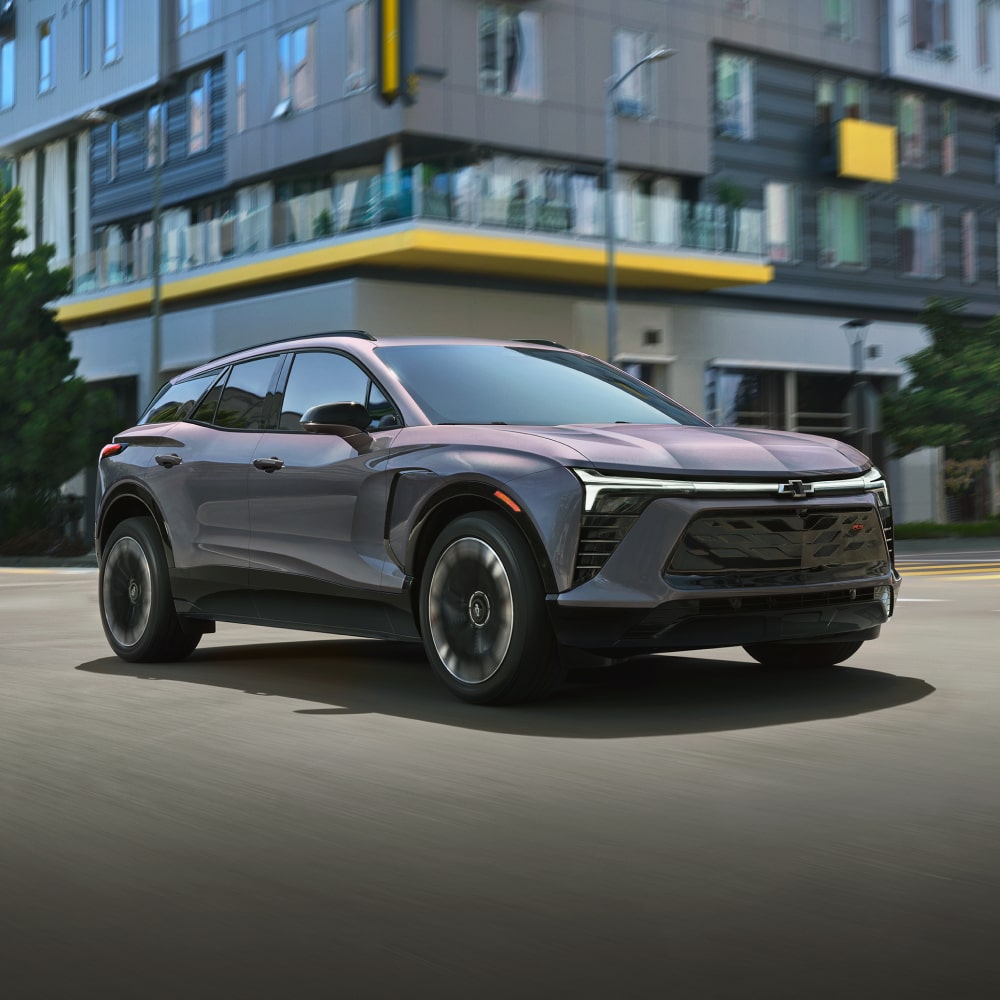 2025 Chevy Blazer EV Driving Through a City Intersection