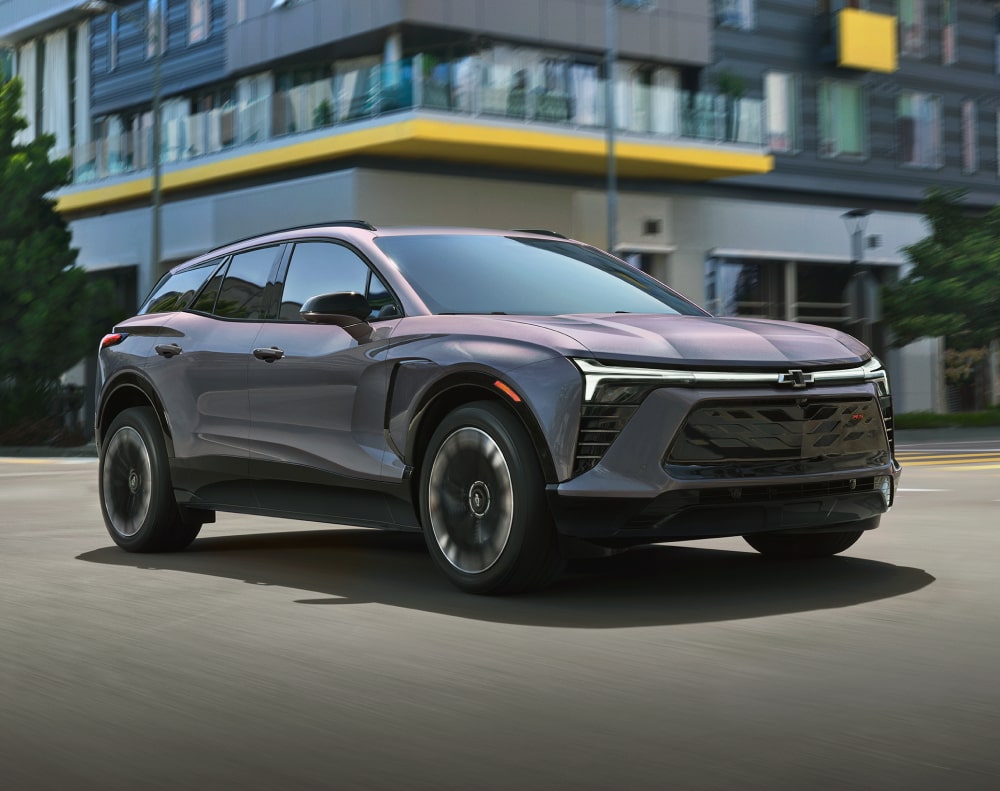 2025 Chevy Blazer EV Driving Through a City Intersection