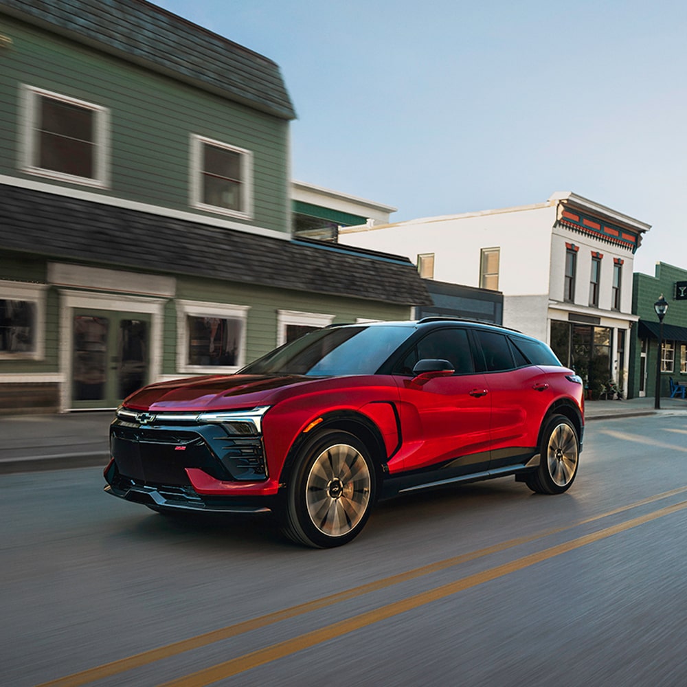 Chevy Blazer EV Driving Through a Quaint Downtown