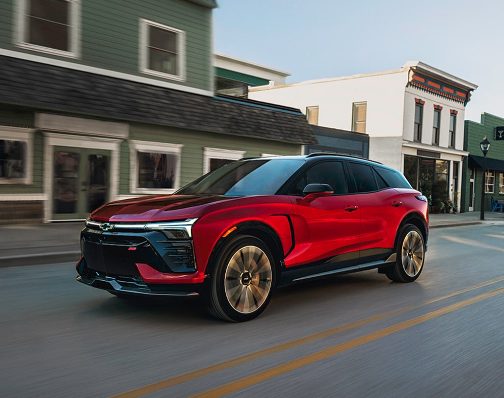 Chevy Blazer EV Driving Through a Quaint Downtown