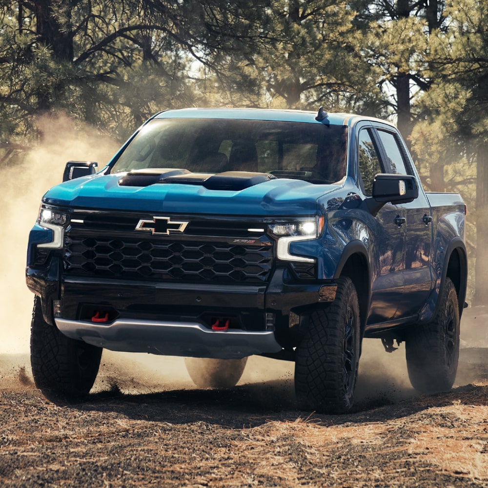 2025 Chevy Colorado Driving Off-Road on a Dirt Path in the Woods