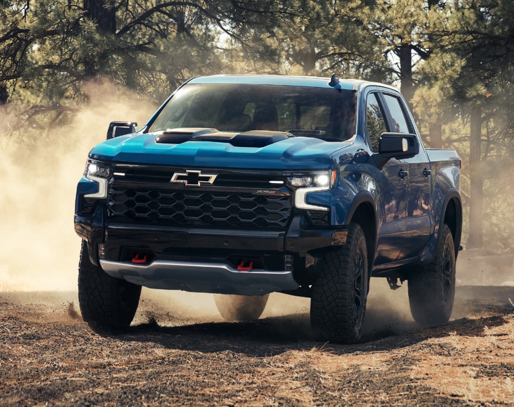 2025 Chevy Colorado Driving Off-Road on a Dirt Path in the Woods