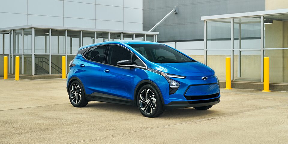 Day light shot of a Blue Bolt EV parked outdoors