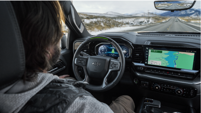 A Man Using Super Cruise Hands-Free Driving Technology in His Chevy Vehicle