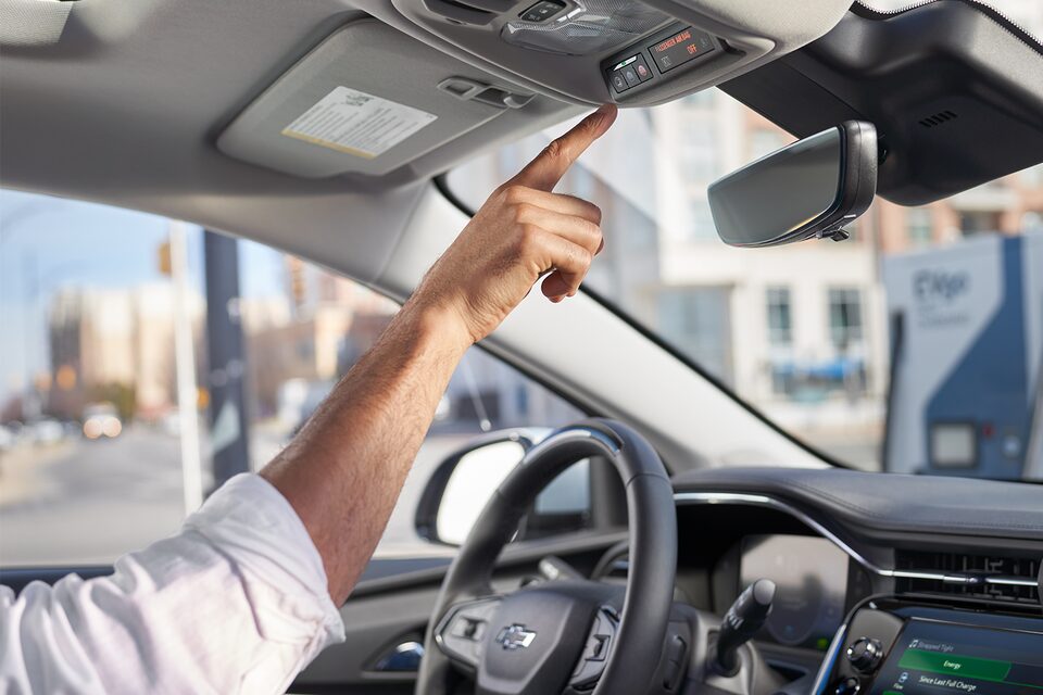 A Man Adjusts the Settings of his Chevy