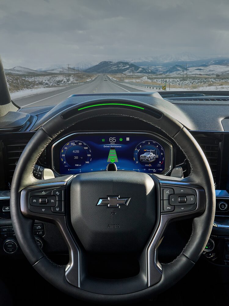 Close-up of a Chevy Steering Wheel with Text Overlay Reading "Hands-free Driving Explained"