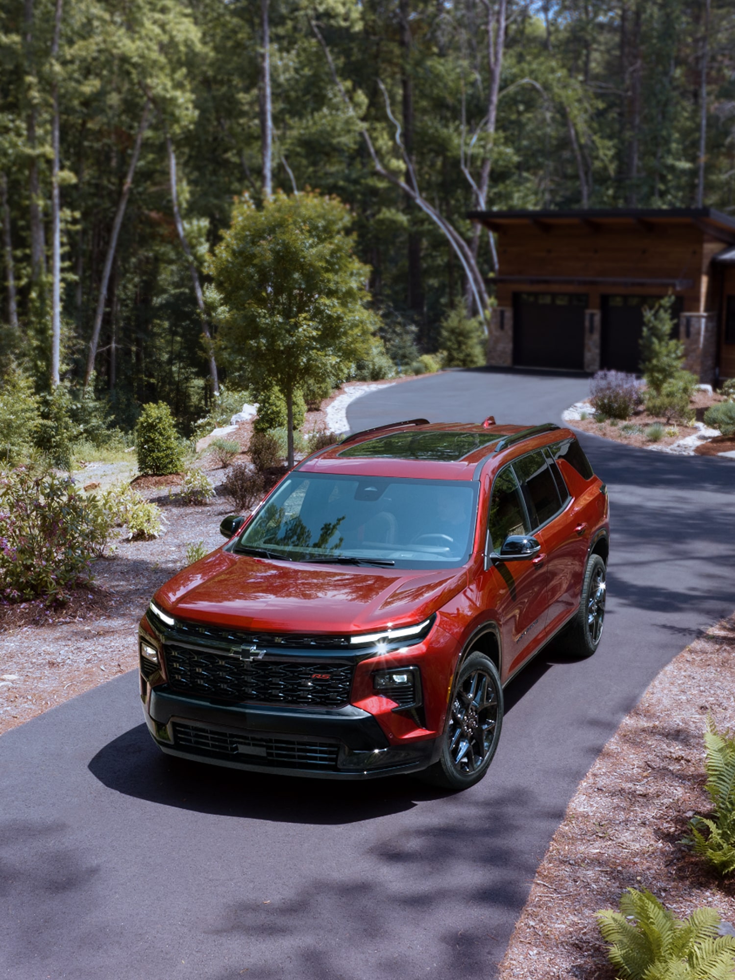 2025 Chevy Traverse Driving Down a Curvy Driveway