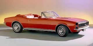Vintage Red Convertible Car in a Studio Setting with a Soft Gradient Background