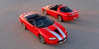 Overhead View of Two Red Sports Cars Parked on Open Pavement