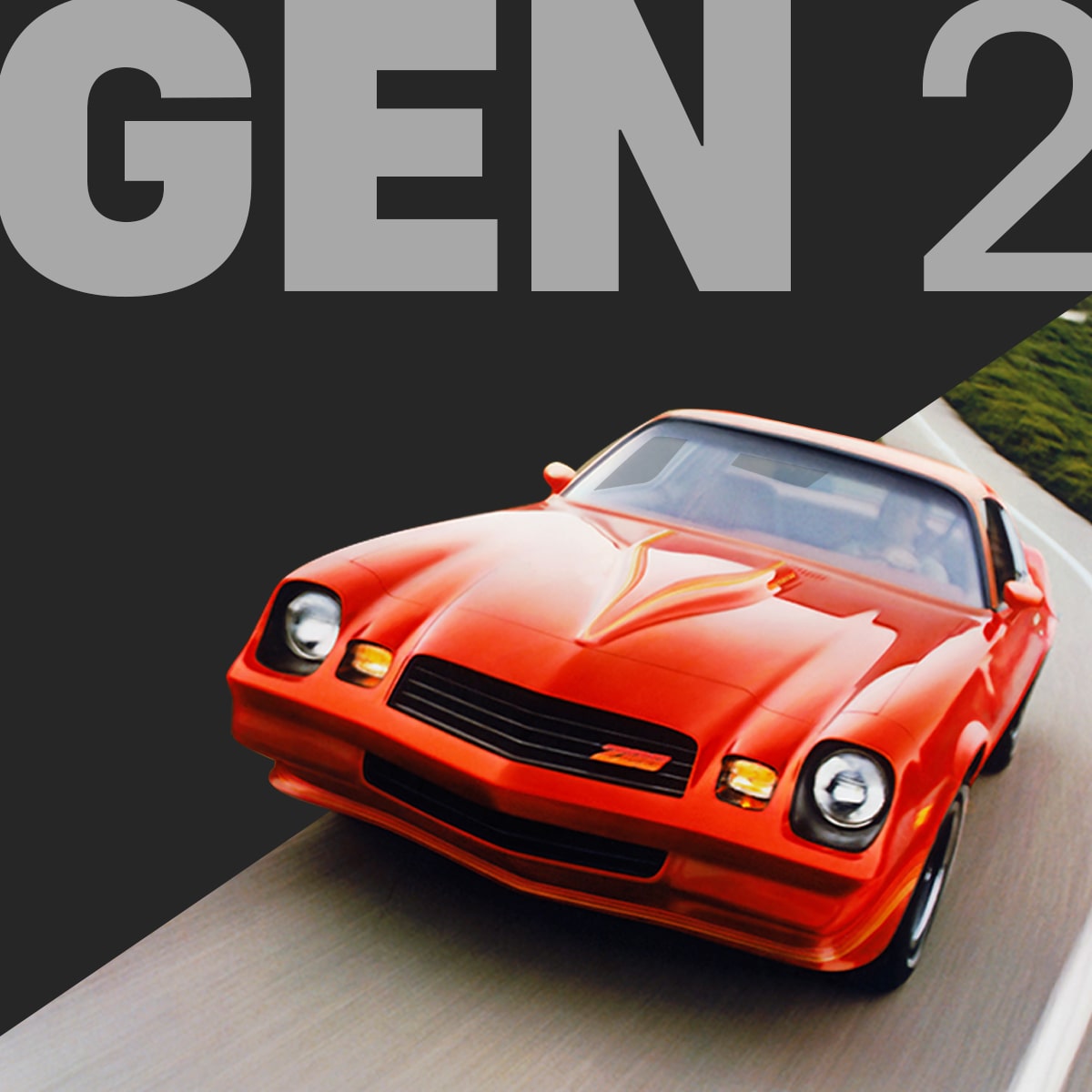 Front View of a Bright Orange Classic Chevy Camaro Driving on a Curving Highway, Captured in Motion